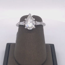 Load and play video in Gallery viewer, 14Kt Gold Semi Mount 0.28 Carat Weight Diamond Center 1.01 Carat Pear Diamond Ring
