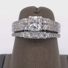 Load and play video in Gallery viewer, 18Kt Gold Center 0.80 Carat Cushion Sides 0.45 Carat Diamonds with Wedding Band
